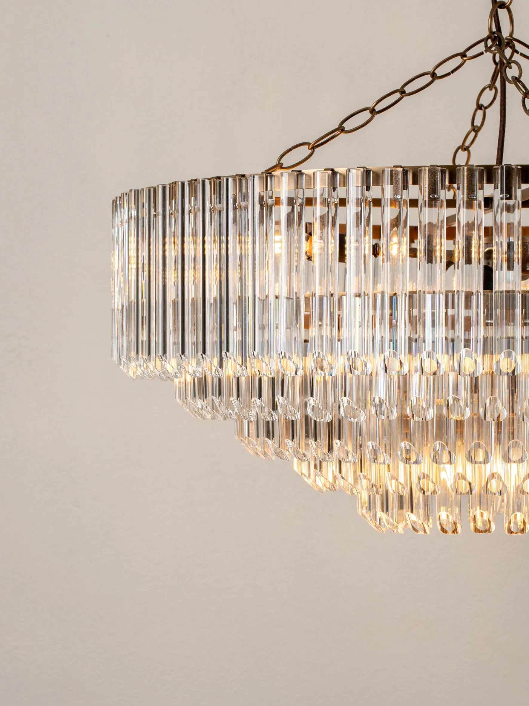 Petalia - 9 light aged brass and clear glass tube wide chandelier